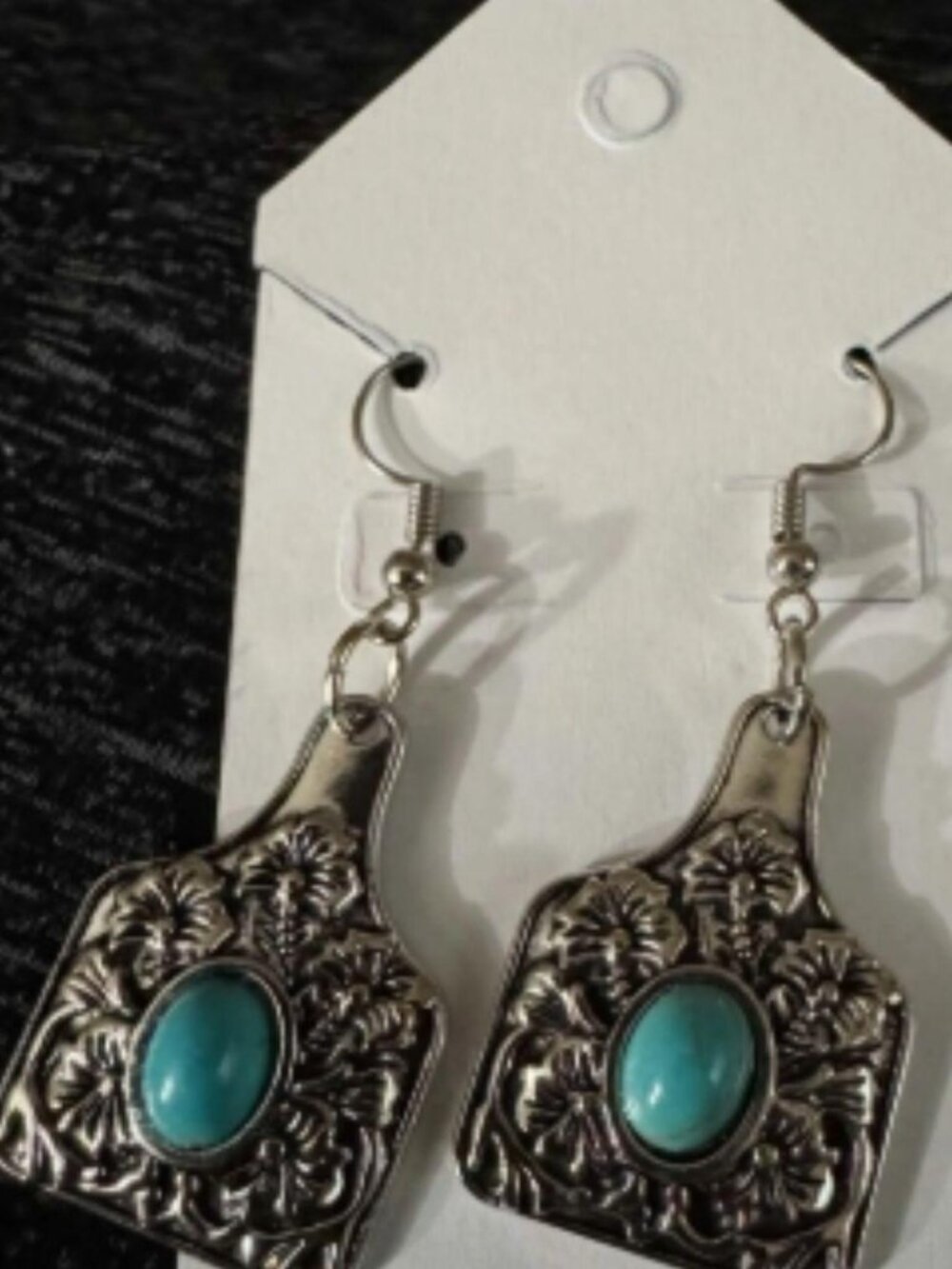 beautiful handmade earrings feature ornate silver-tone charms